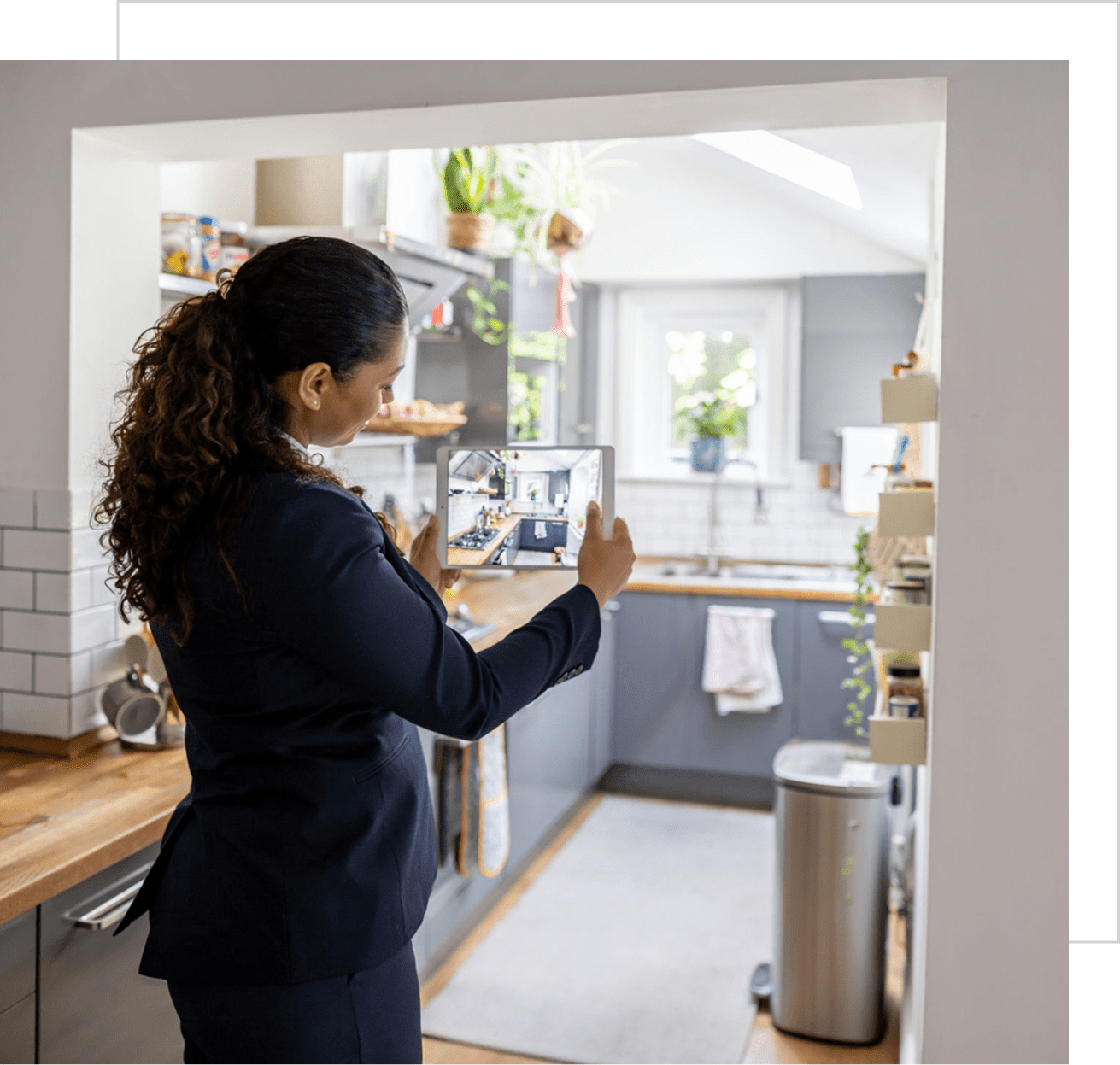 Person taking photo of stylish kitchen