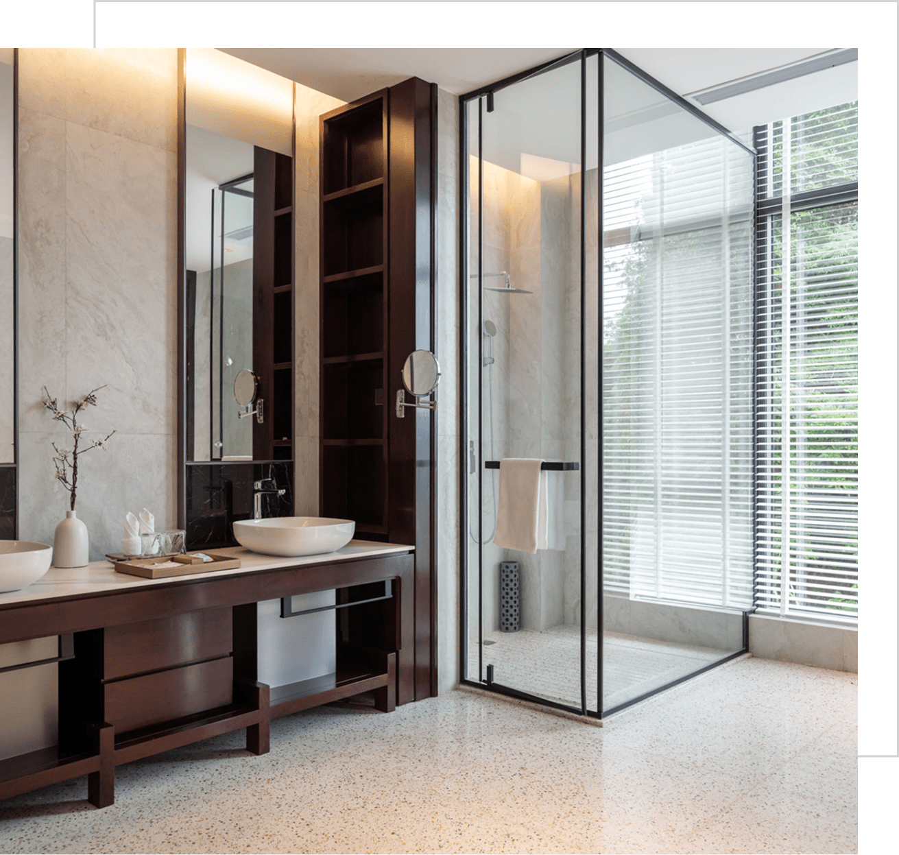 Spacious bathroom with natural light and mirrors